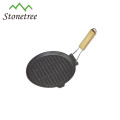 round vegetable oil cast iron skillet with wooden handle